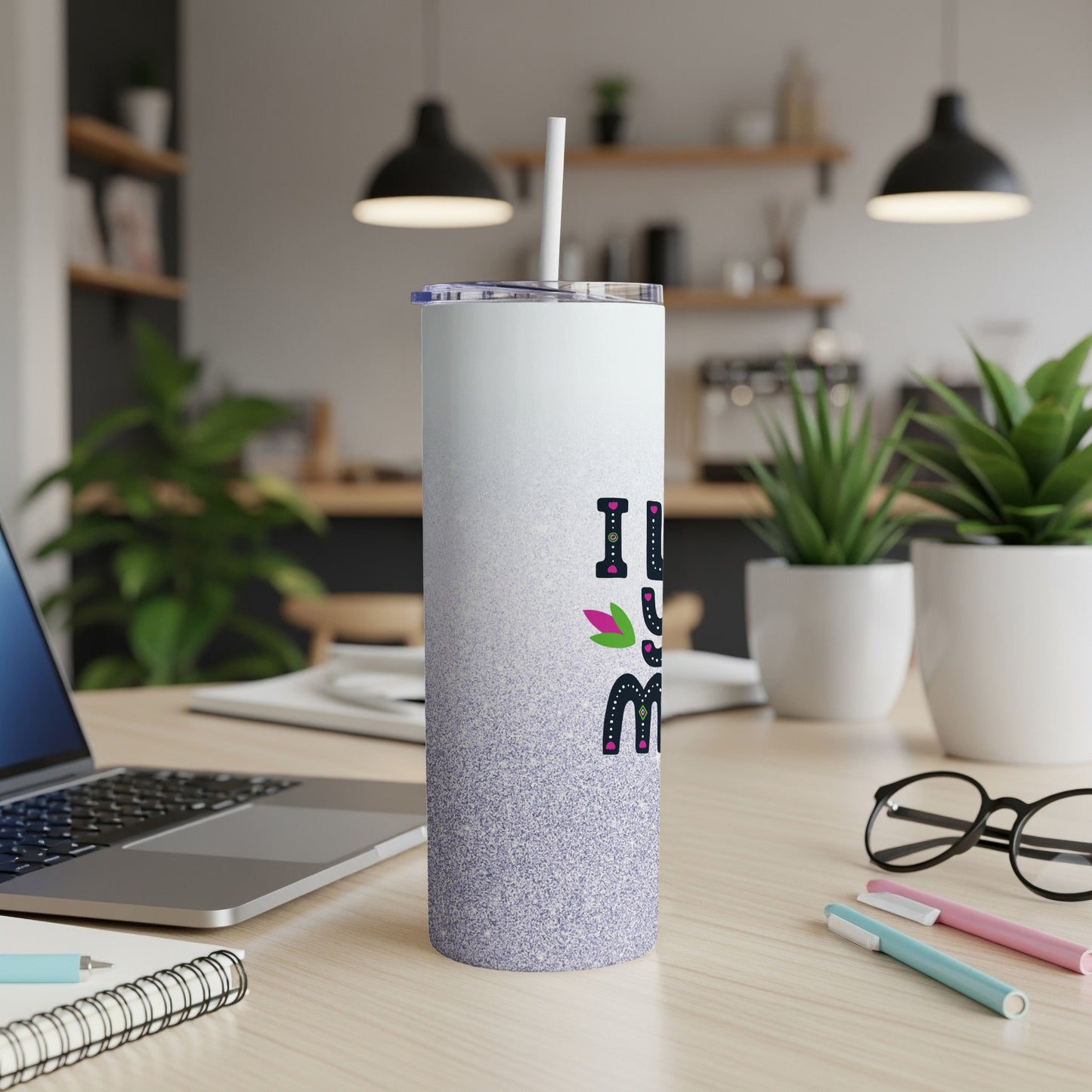 Purple glitter tumbler with "I love mom" text and floral accent.
