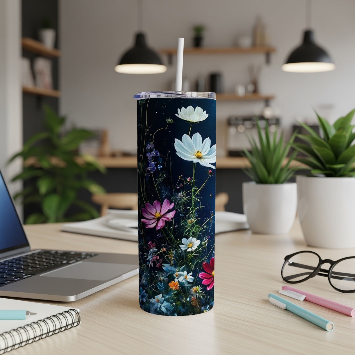 Tall tumbler with colorful wildflowers on a dark starry background.