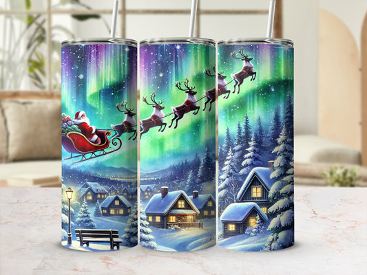 Santa and Reindeer Flying Over Snowy Village Tumbler