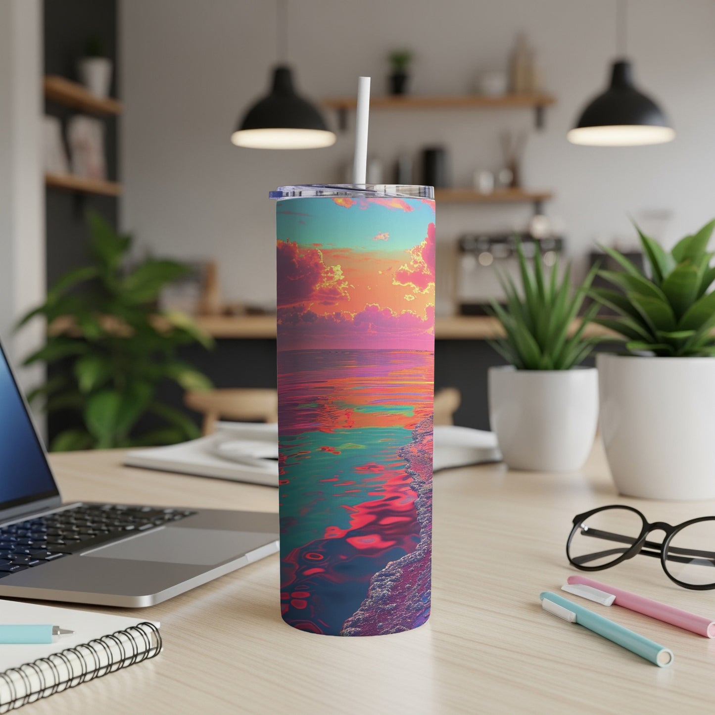 Colorful sunset over water on a skinny tumbler with straw.