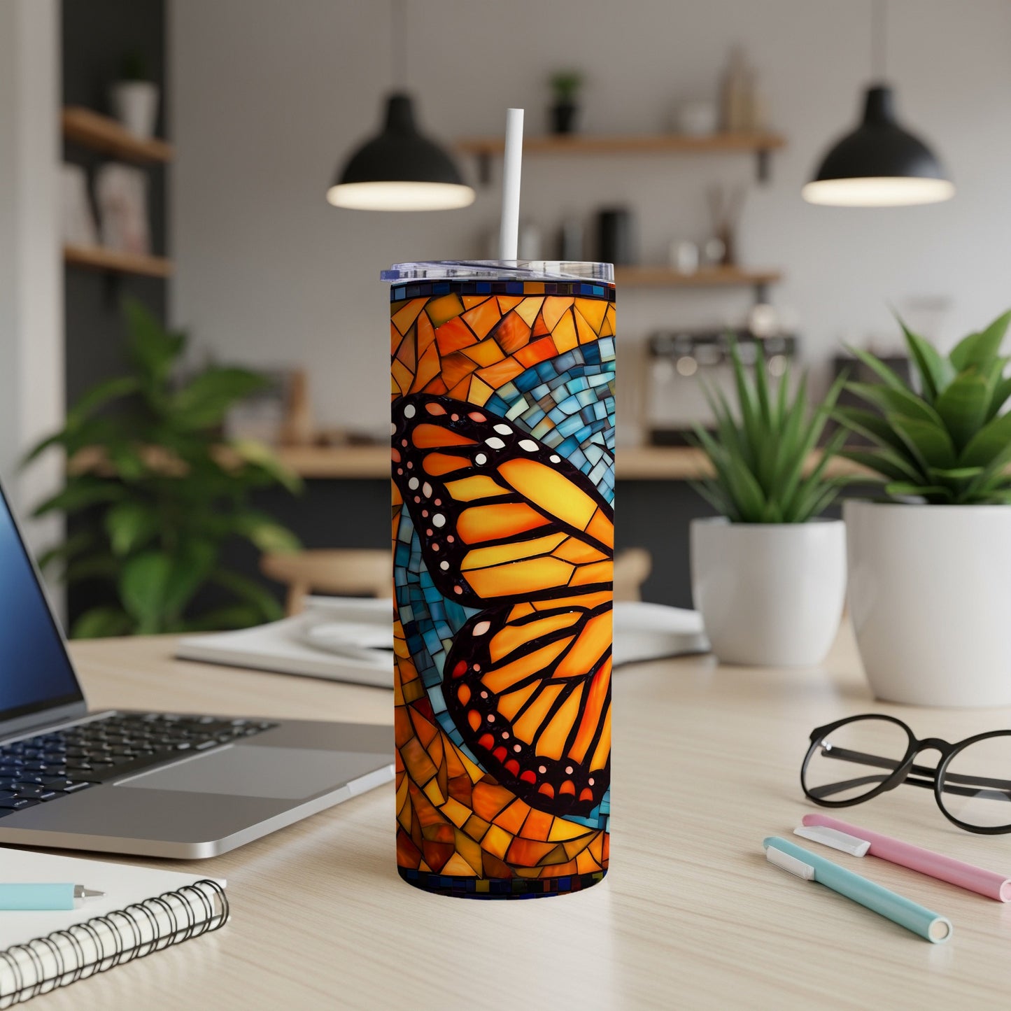 Monarch butterfly stained glass design on a white tumbler with straw.