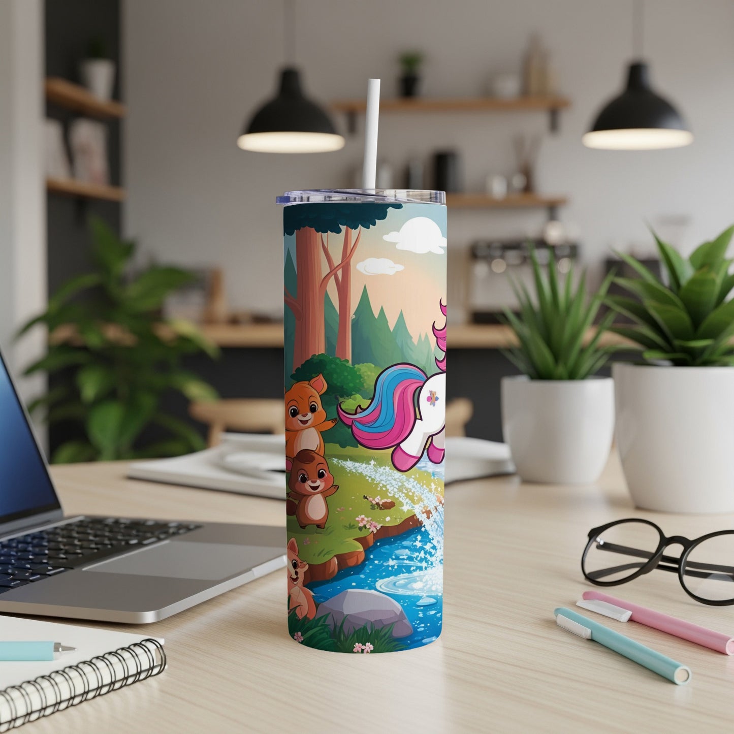 Unicorn and woodland animals by waterfall on a tall tumbler.