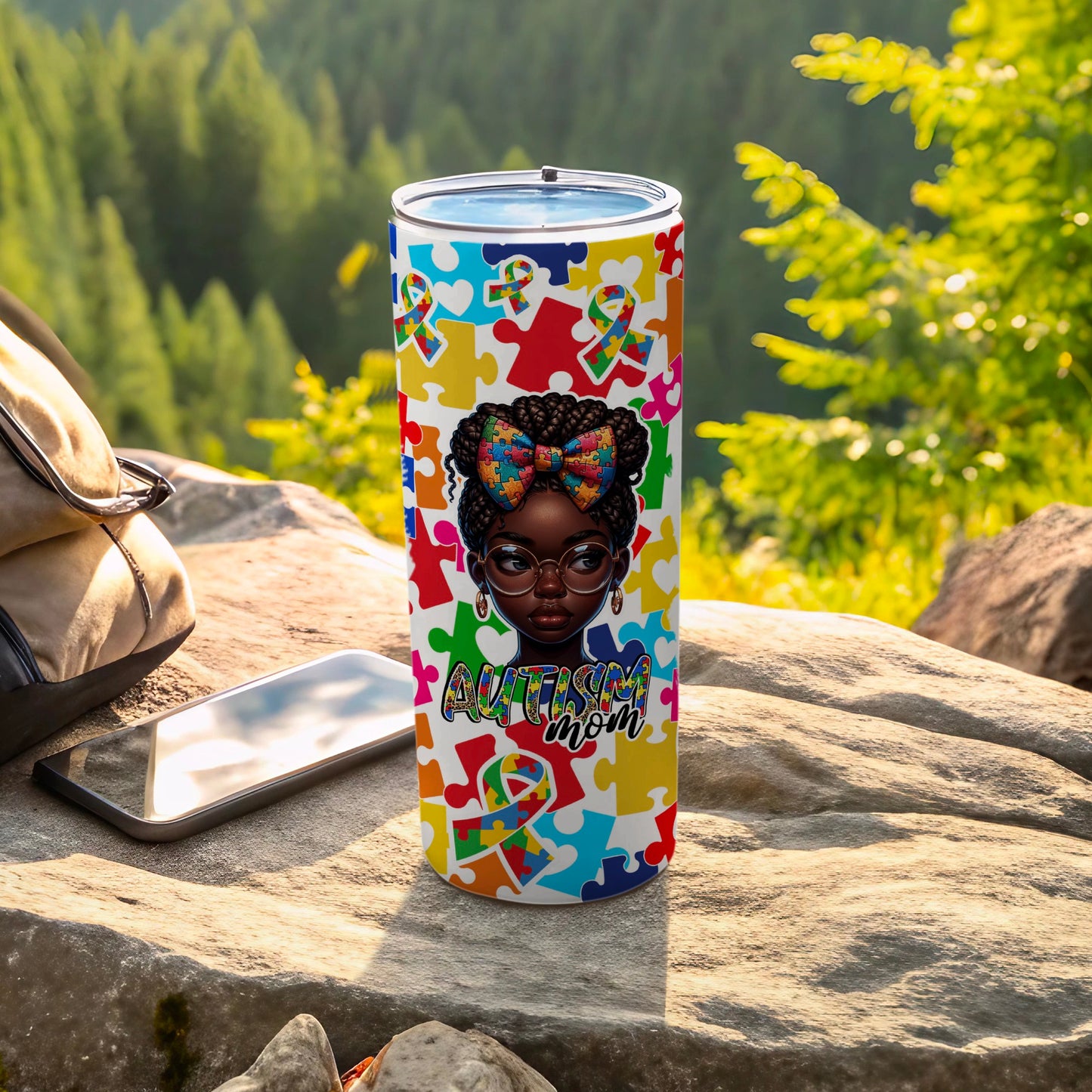 Tumbler with autism puzzle pattern, featuring a woman with glasses.