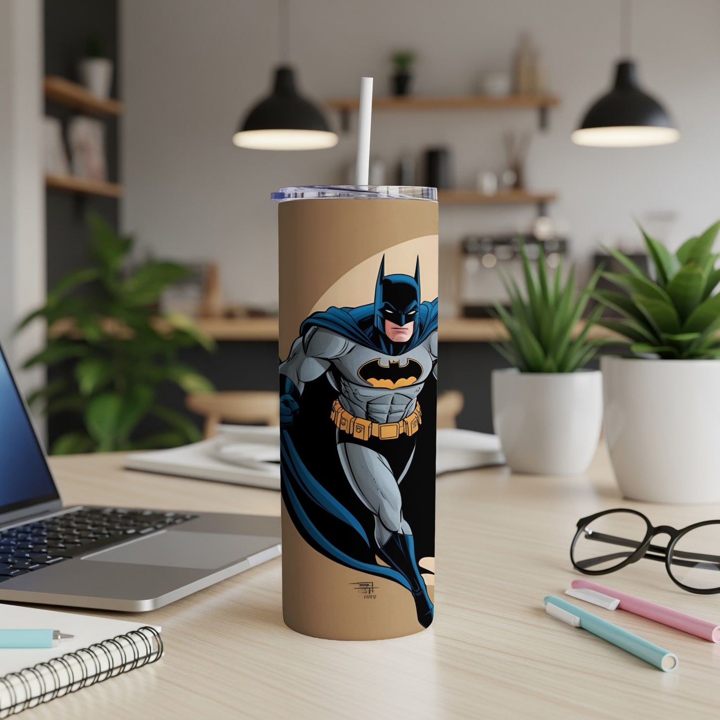 Batman illustration on a tan tumbler with a white straw.