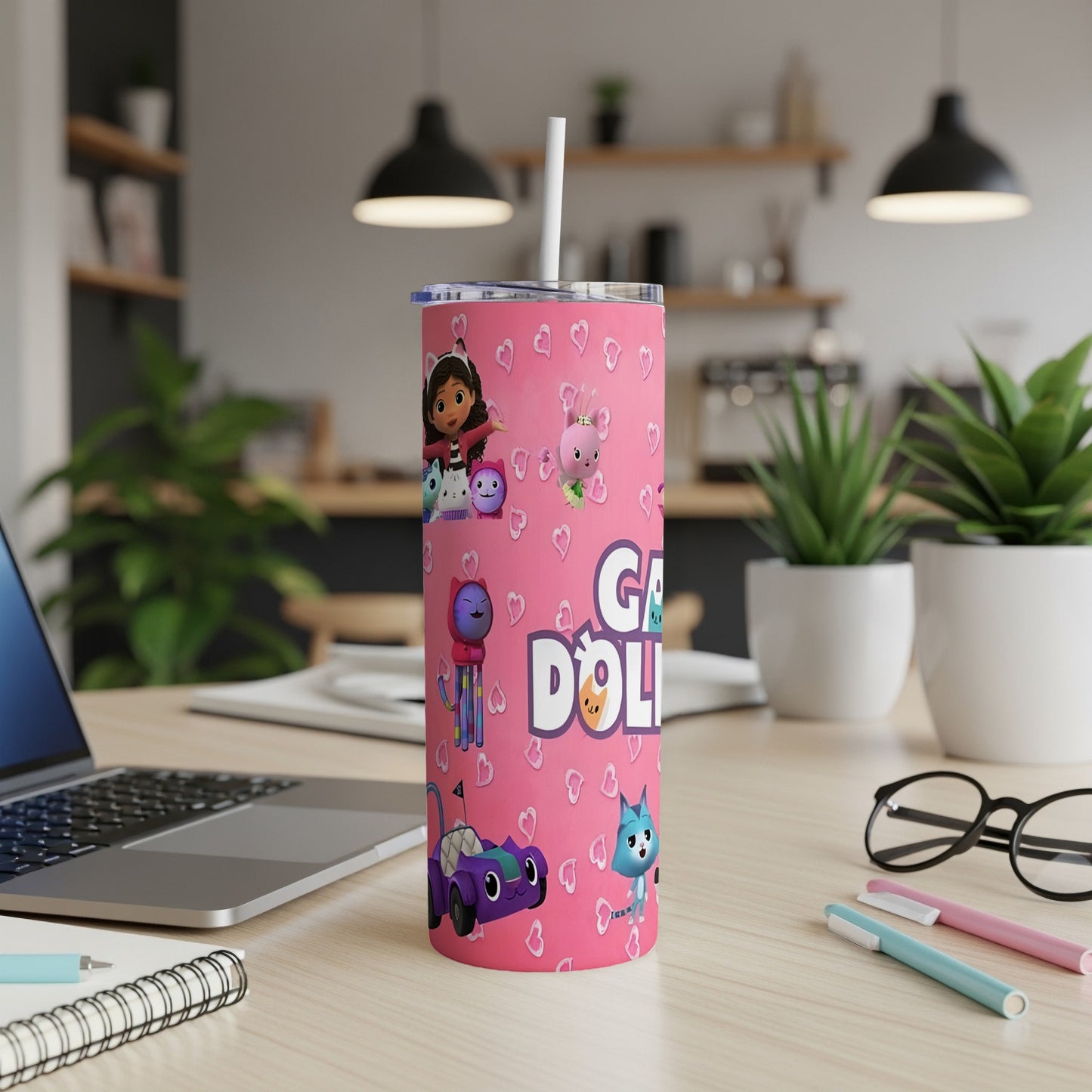 Pink tumbler with Gabby's Dollhouse characters and purple car.