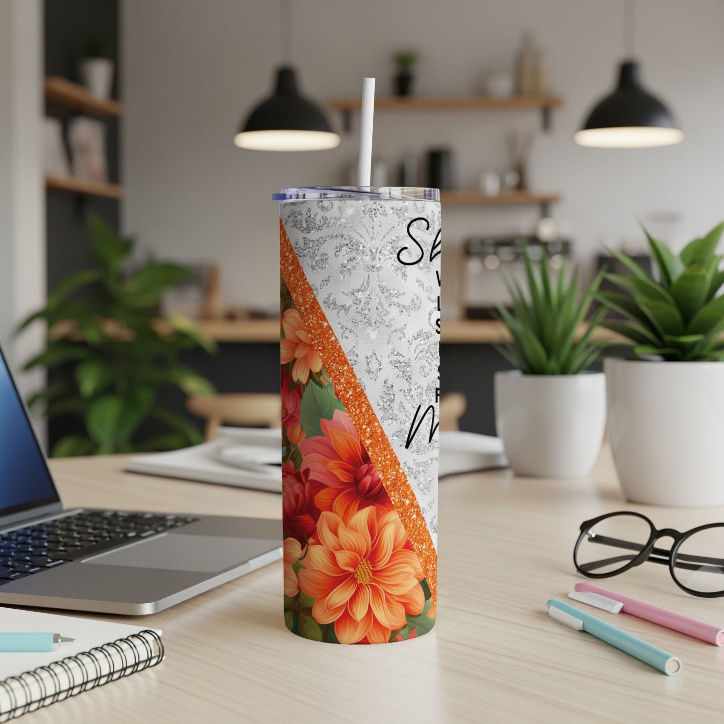 Silver glitter tumbler with orange floral pattern and white text.