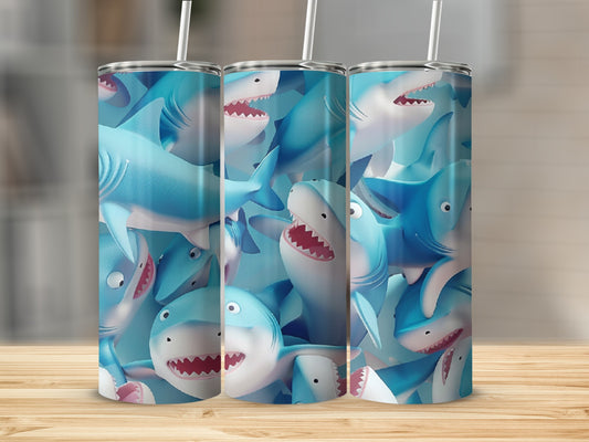 Three blue tumblers with a pattern of cartoon sharks.