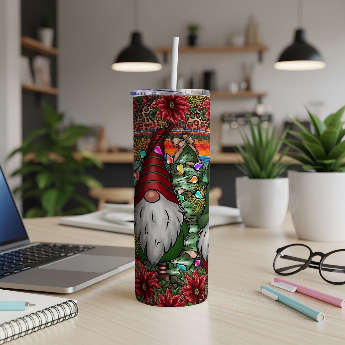 Christmas gnome tumbler with festive lights and poinsettias.