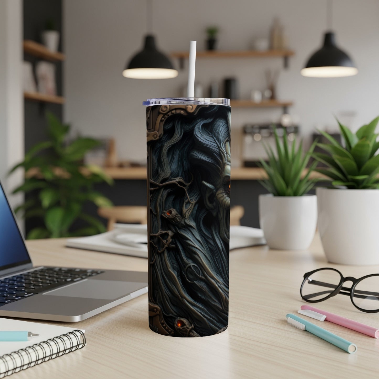 Tall tumbler with dark, detailed fantasy artwork and a white straw.