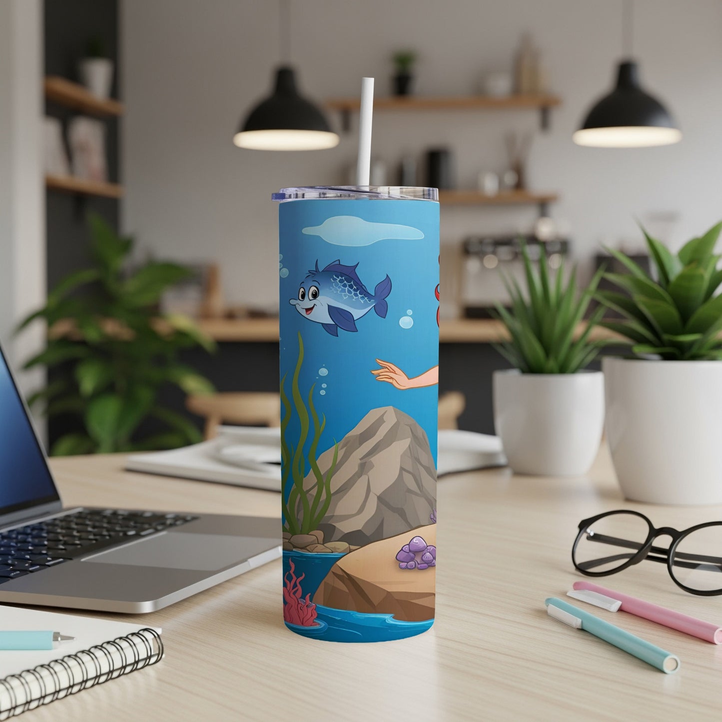Blue cartoon fish and mermaid tail on a underwater scene tumbler.