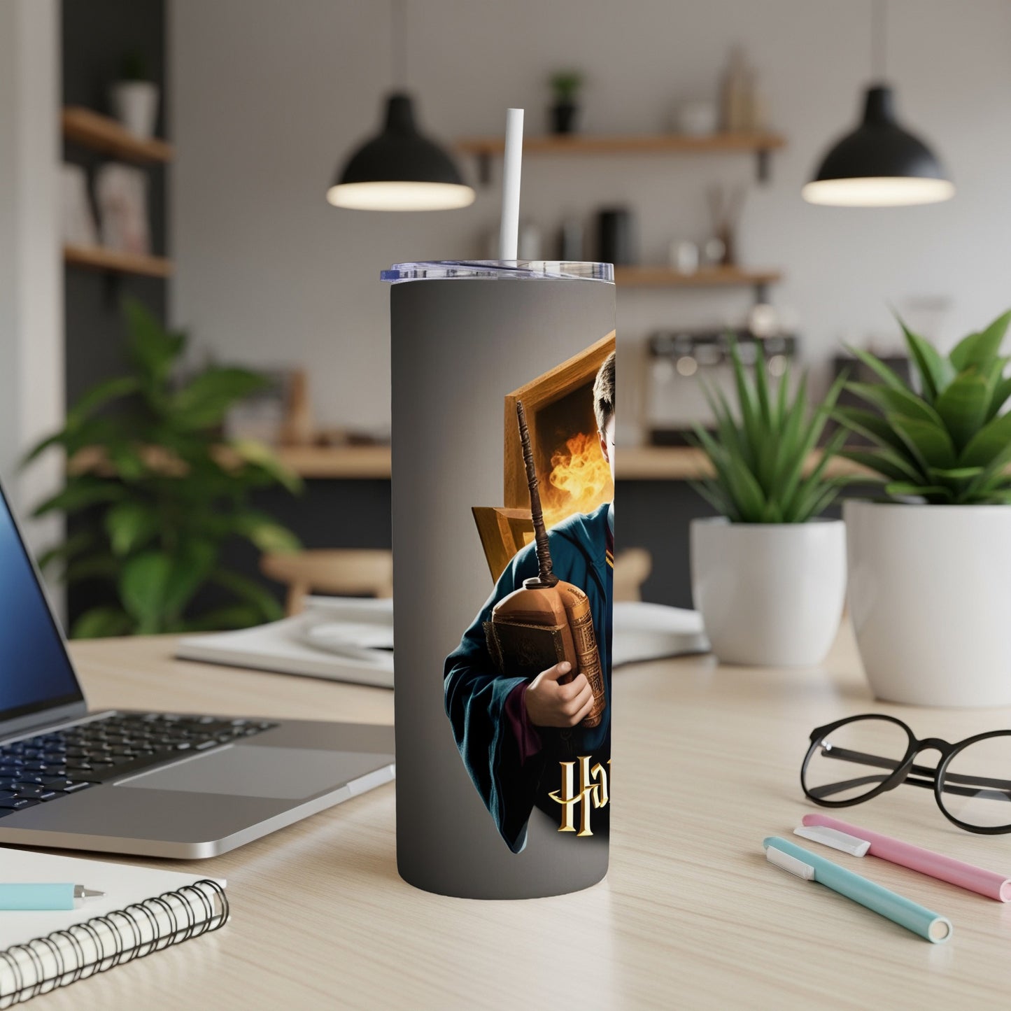 Harry Potter character on a gray tumbler with a white straw.
