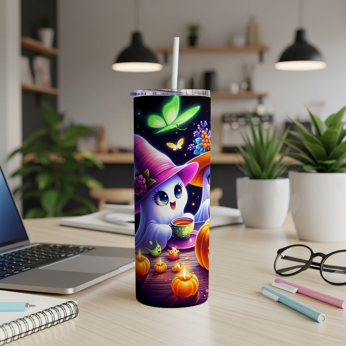 Tumbler with cute ghost wearing a witch hat holding a cup, with butterflies and pumpkins.
