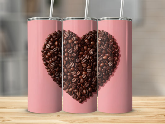Three pink tumblers with a heart shape made of coffee beans.