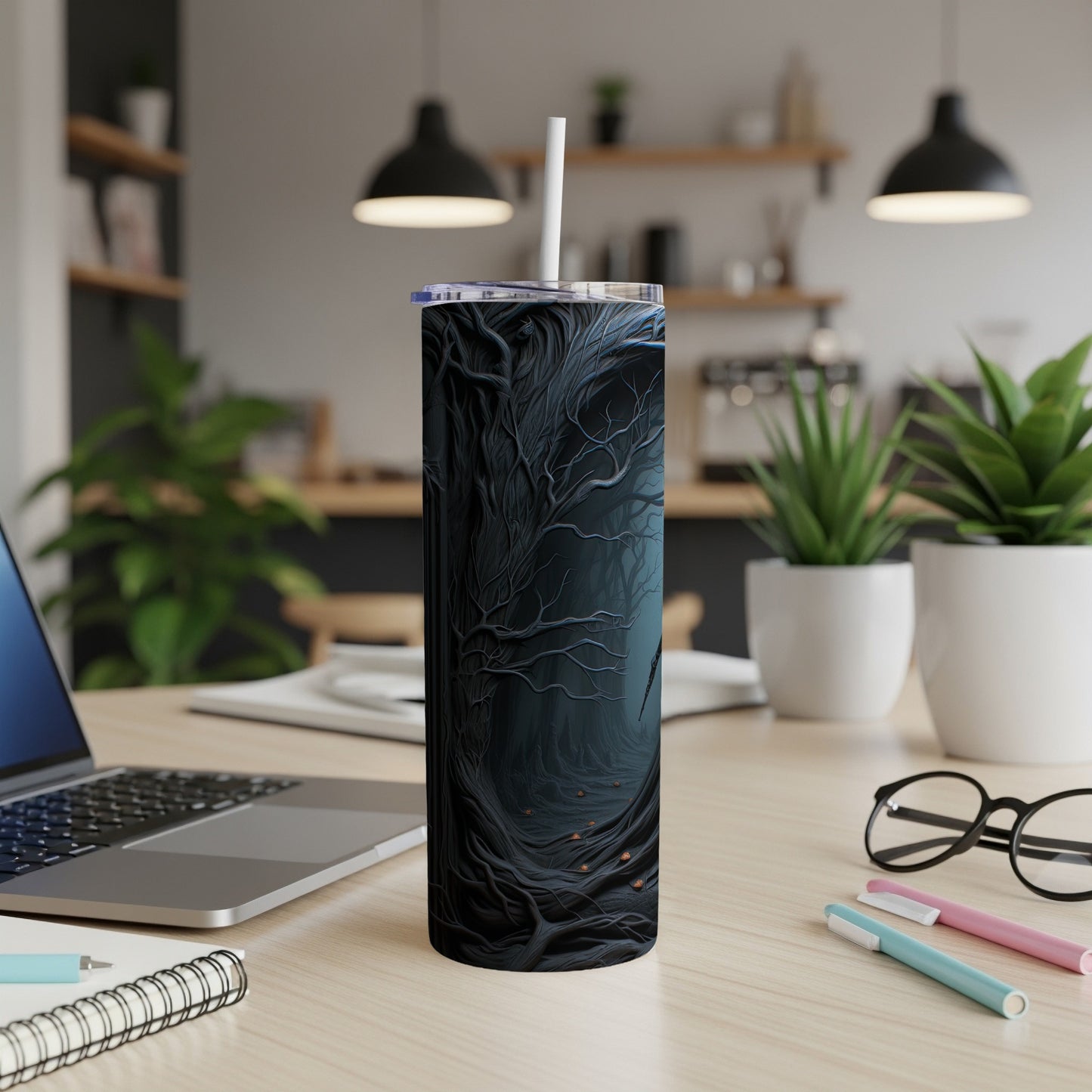 Tumbler with dark, gnarled tree forest design and white straw.