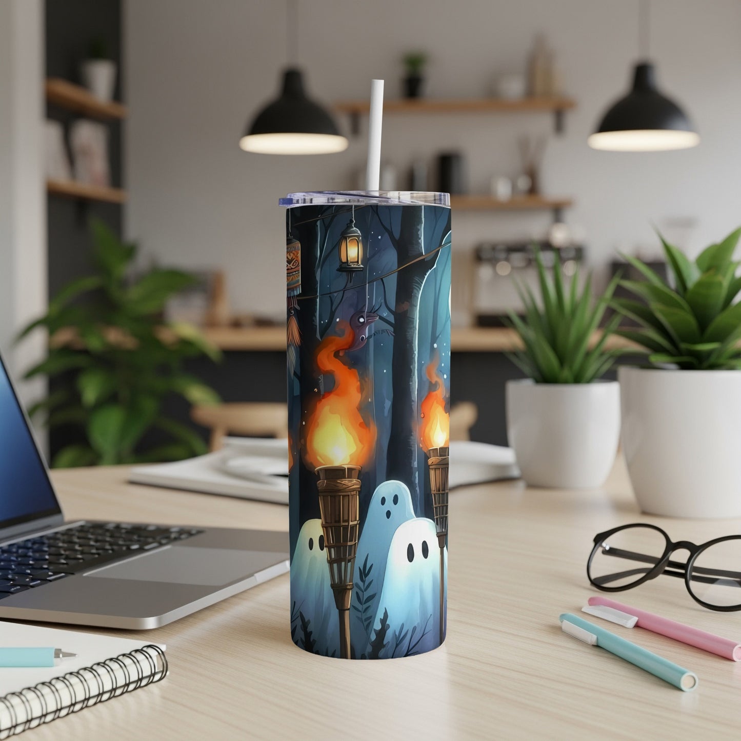 Tumbler with ghosts and torches in a dark forest design.