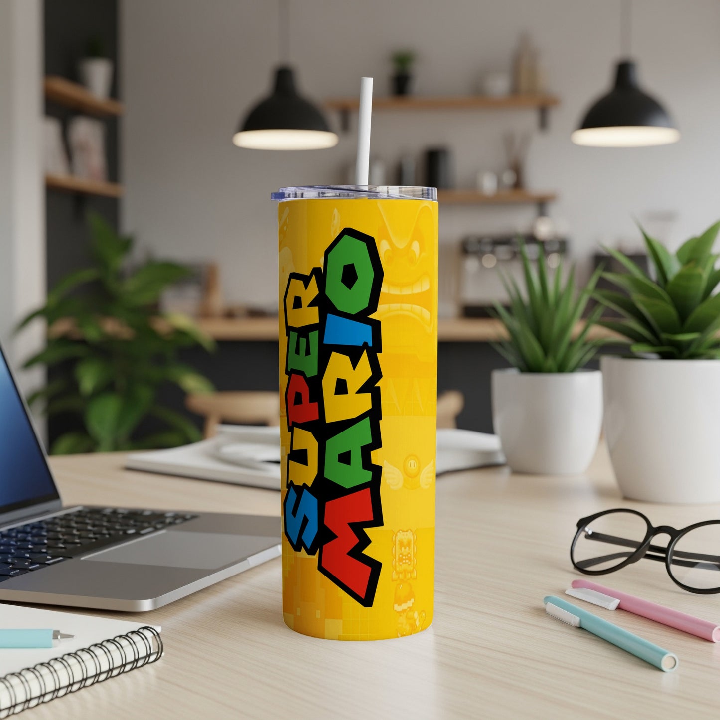 Super Mario character collage on a yellow tumbler with a straw.