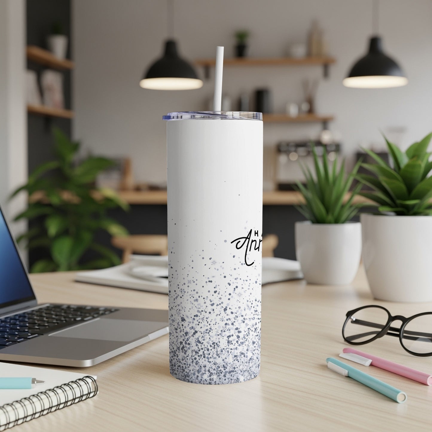 White tumbler with scattered gray dots and black text.