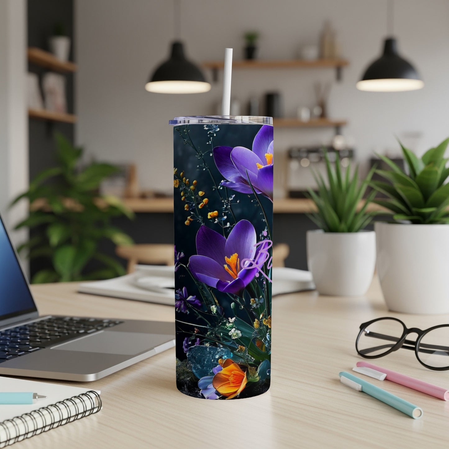 Purple crocuses and floral accents on a dark, tall tumbler.