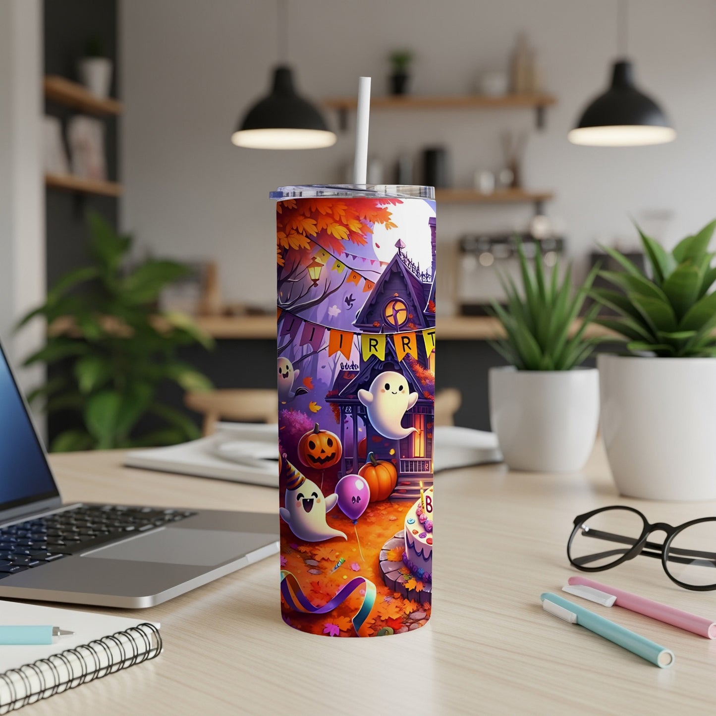 Halloween tumbler with ghosts, pumpkins, and a spooky house.