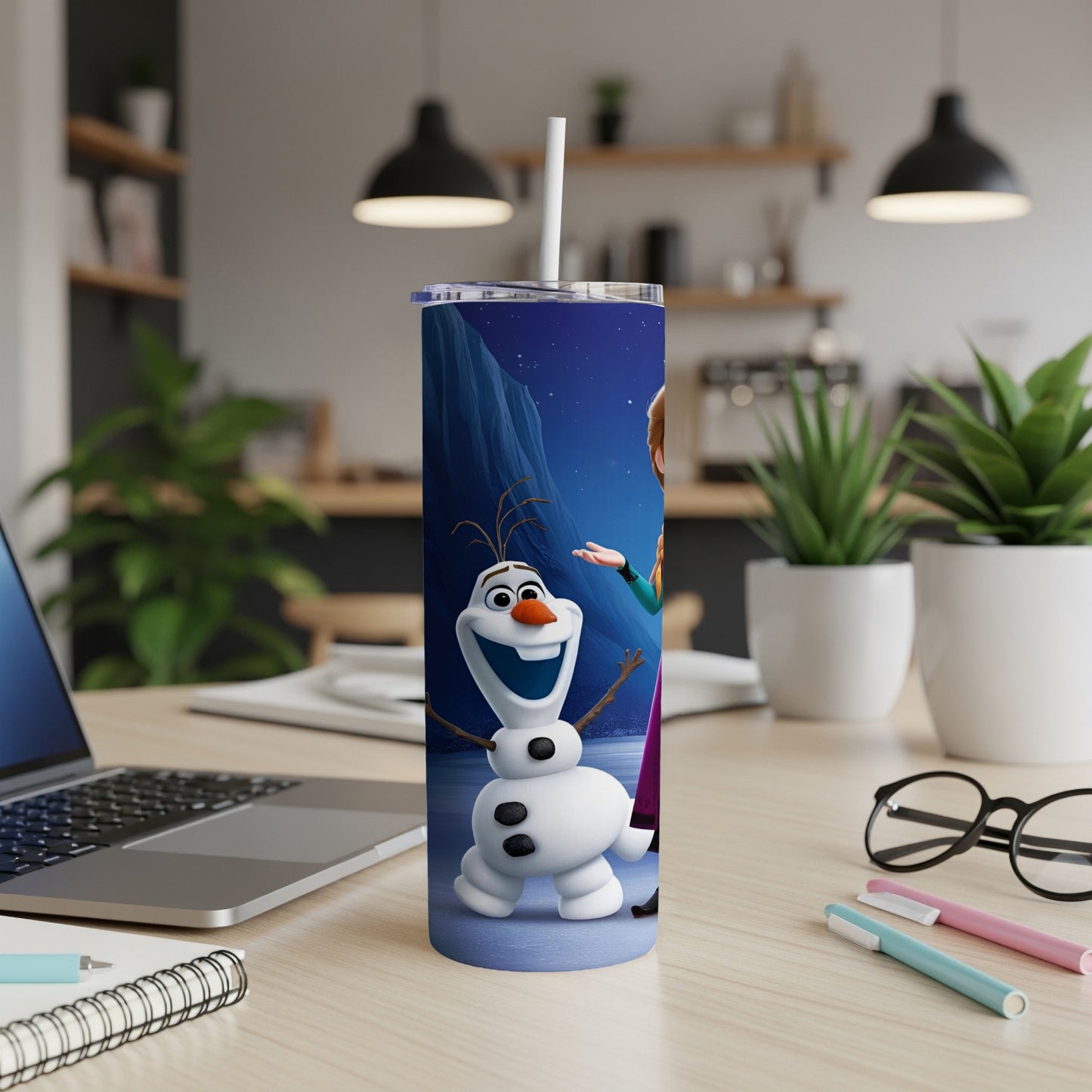 Olaf and Anna from Frozen on a blue insulated tumbler with a straw.