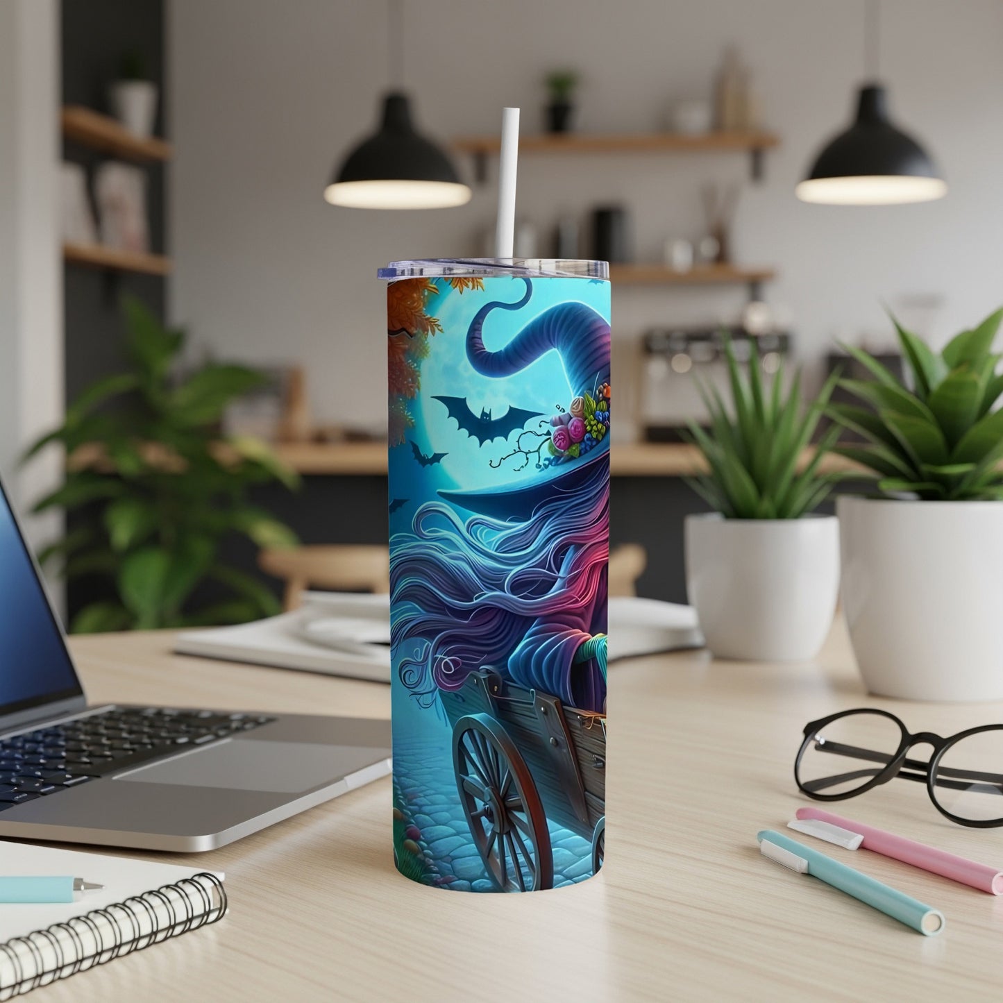 Tumbler with colorful witch illustration and bats against a moonlit sky.