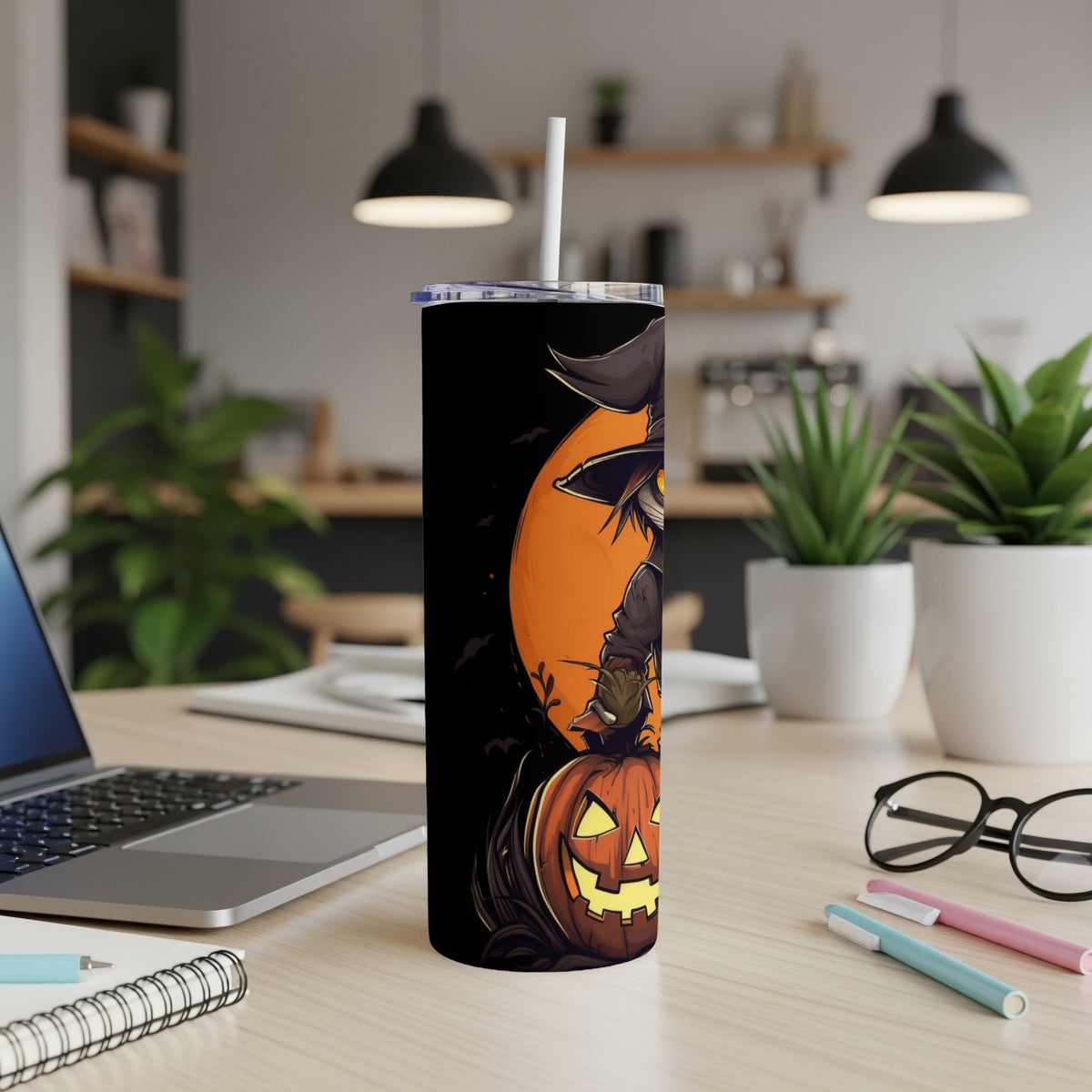 Halloween tumbler with witch and jack-o'-lantern illustration.