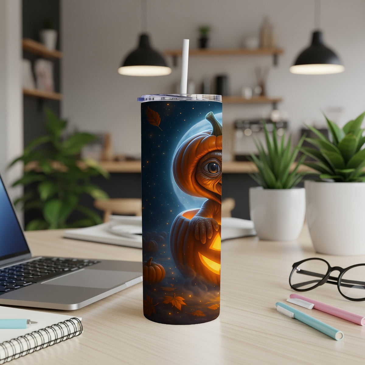Tumbler with a glowing jack-o'-lantern and moon Halloween design.