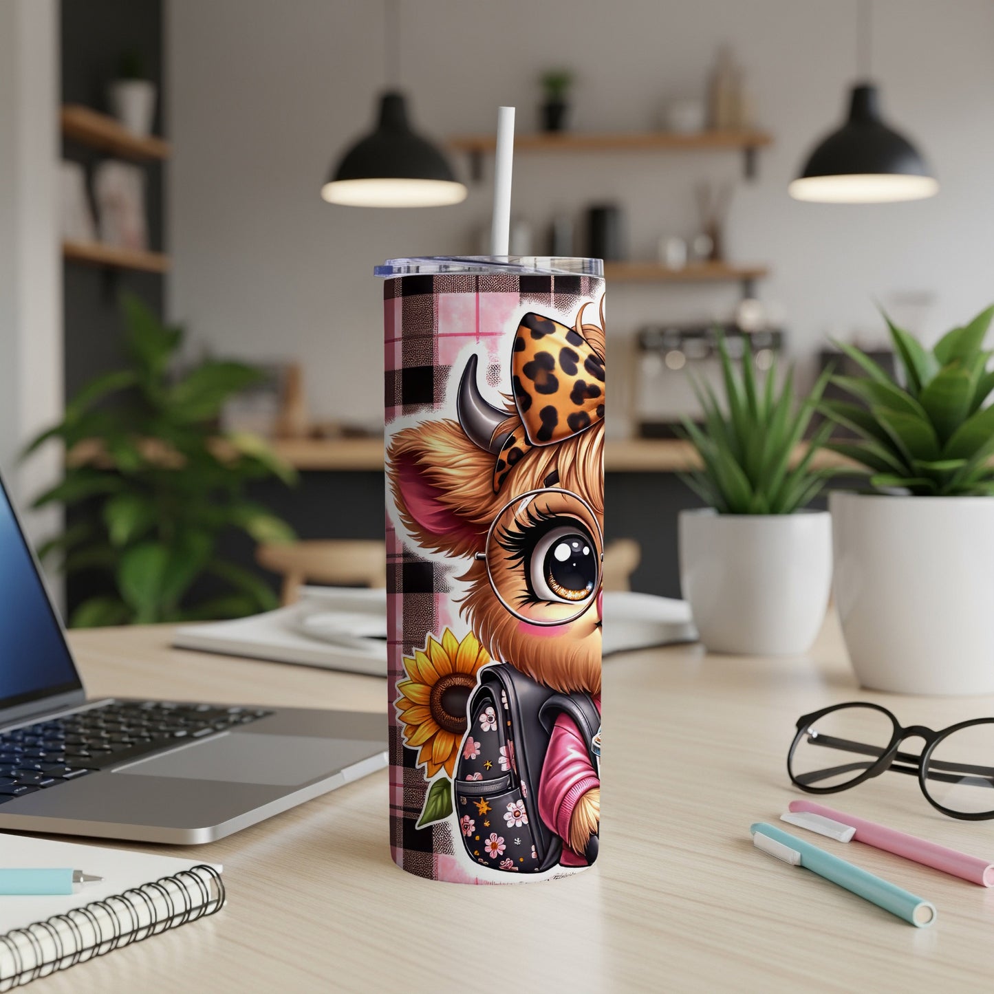 Pink plaid tumbler with cartoon cow wearing glasses and a backpack.
