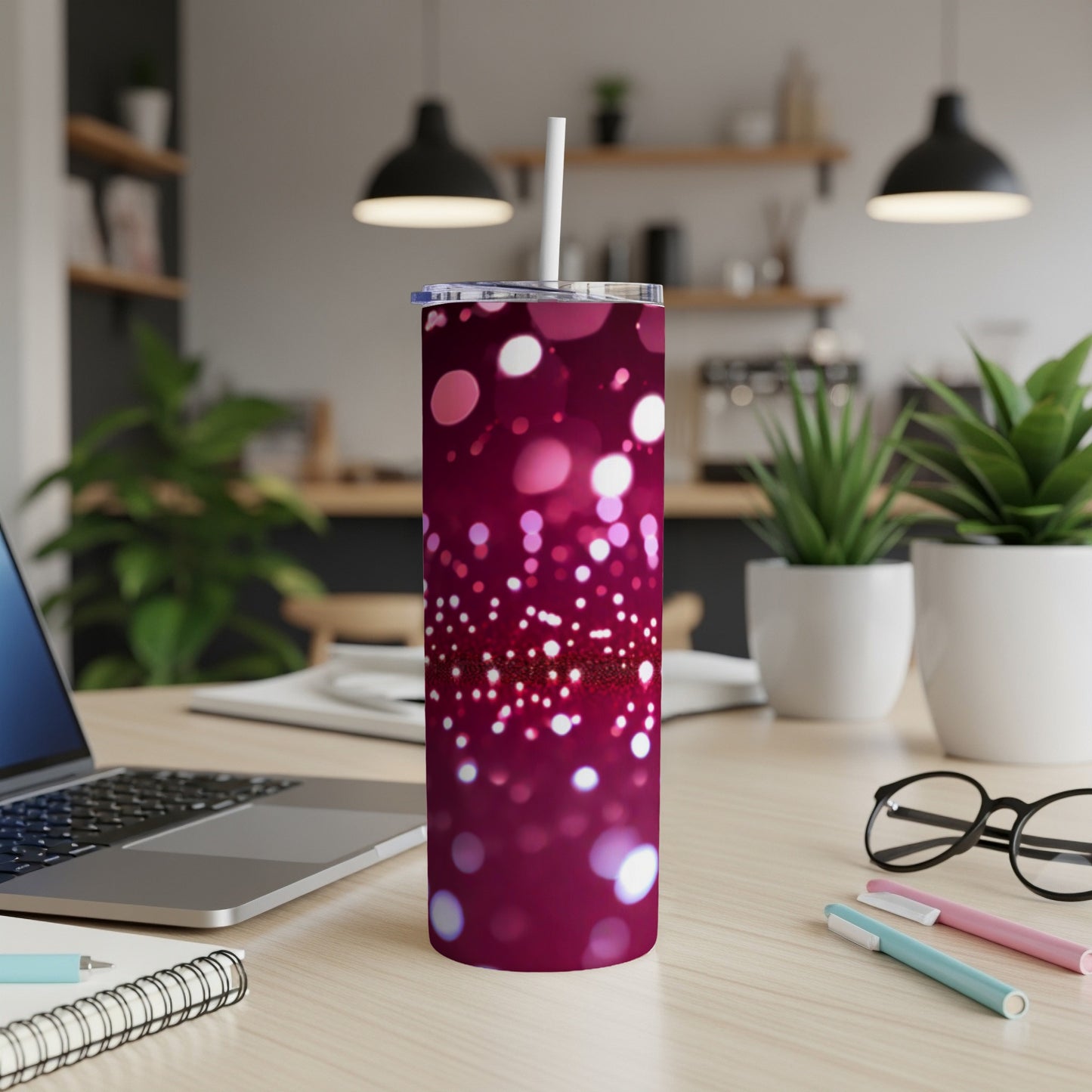 Burgundy tumbler with bokeh lights pattern and white straw.