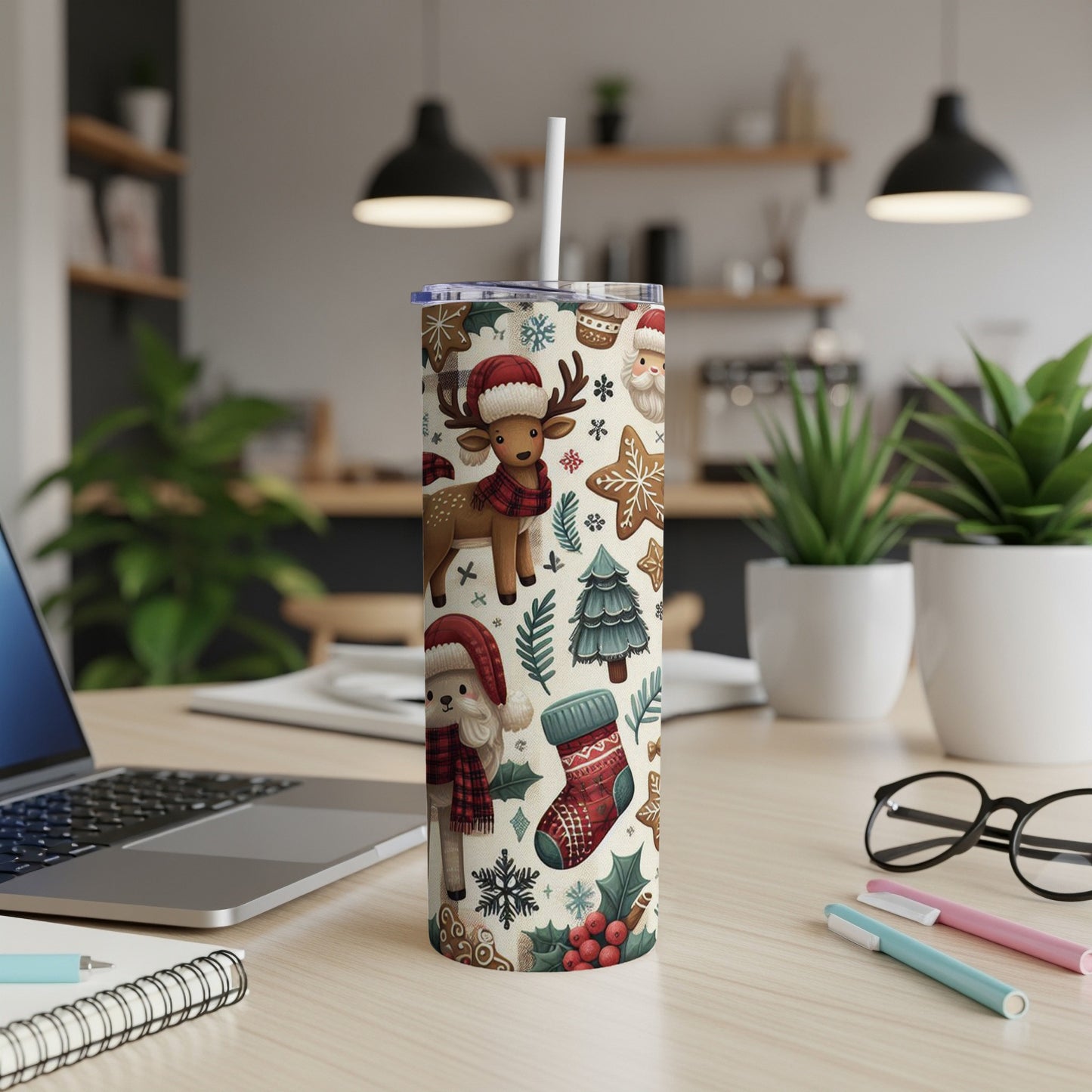 Christmas patterned tumbler with reindeer, gingerbread, and holly motifs.