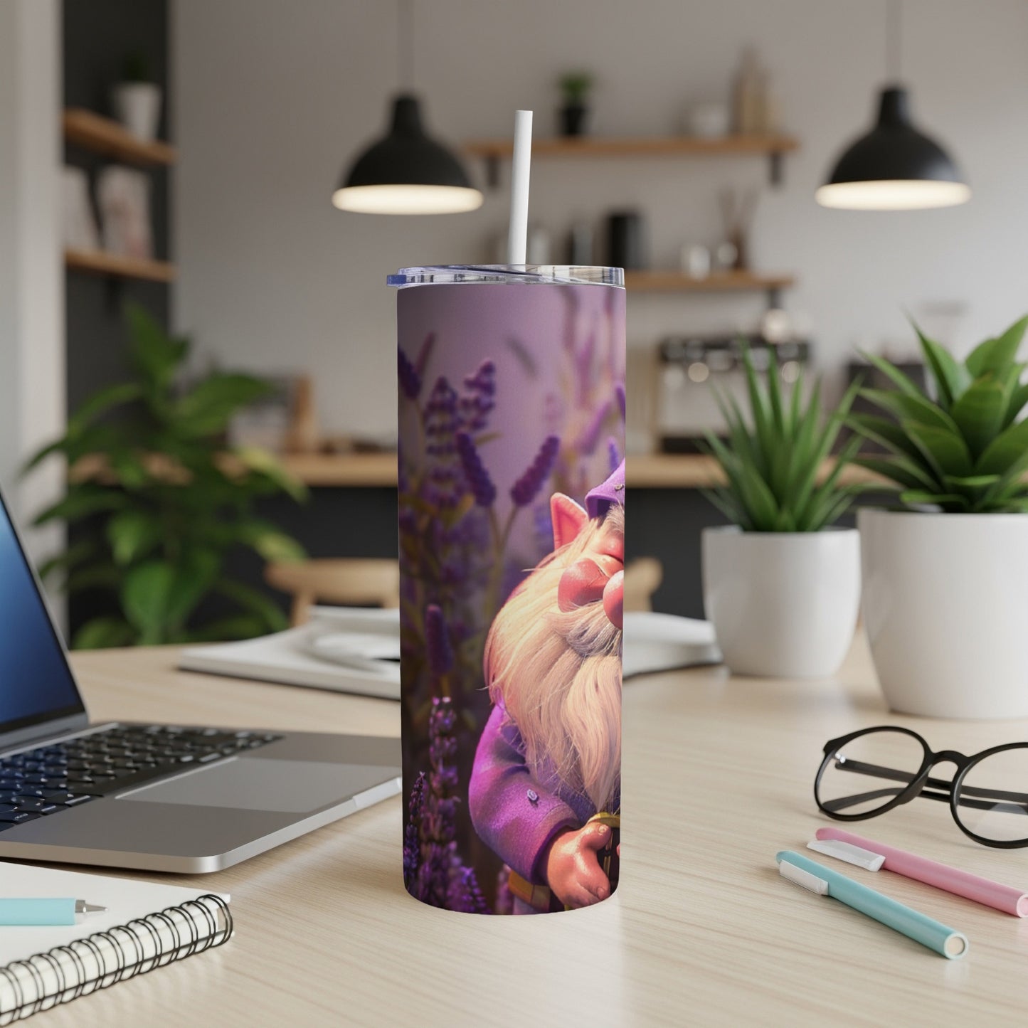 Purple tumbler with a cartoon gnome and lavender, resting on a desk.