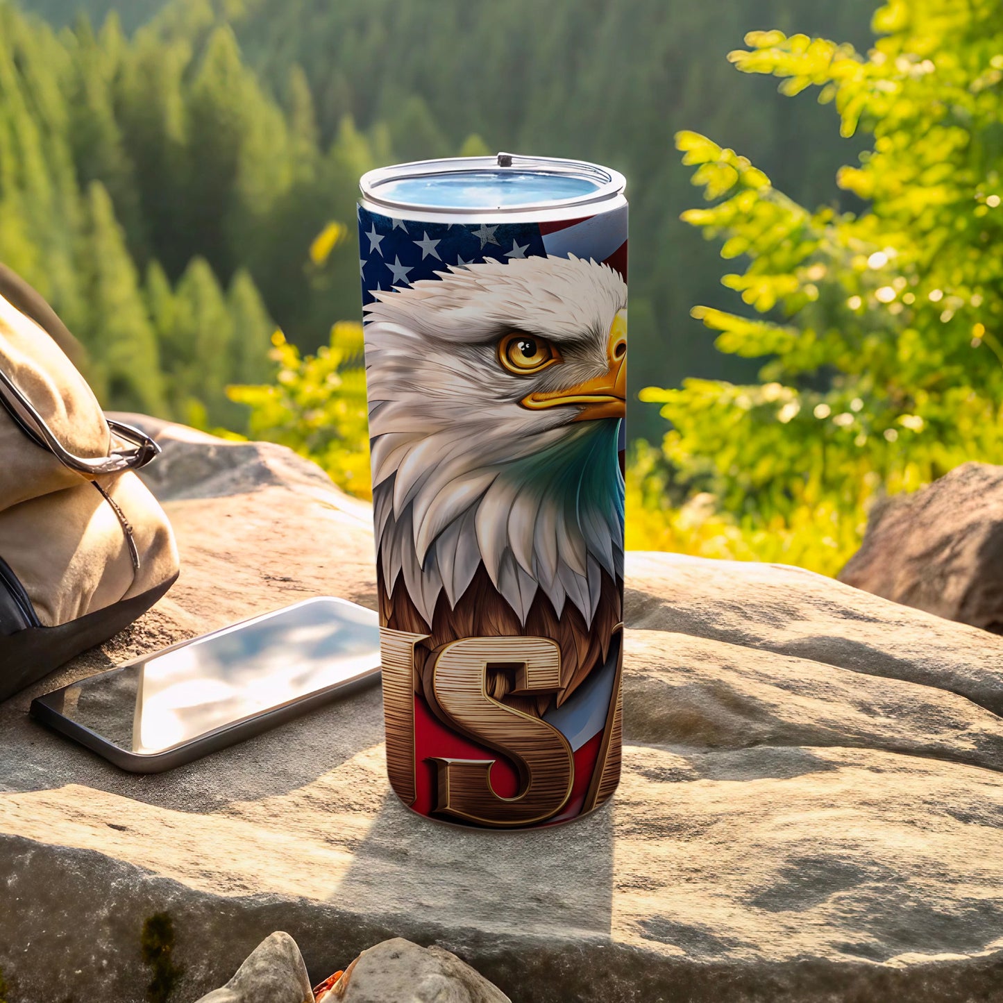 Eagle and US flag design on a stainless steel tumbler.