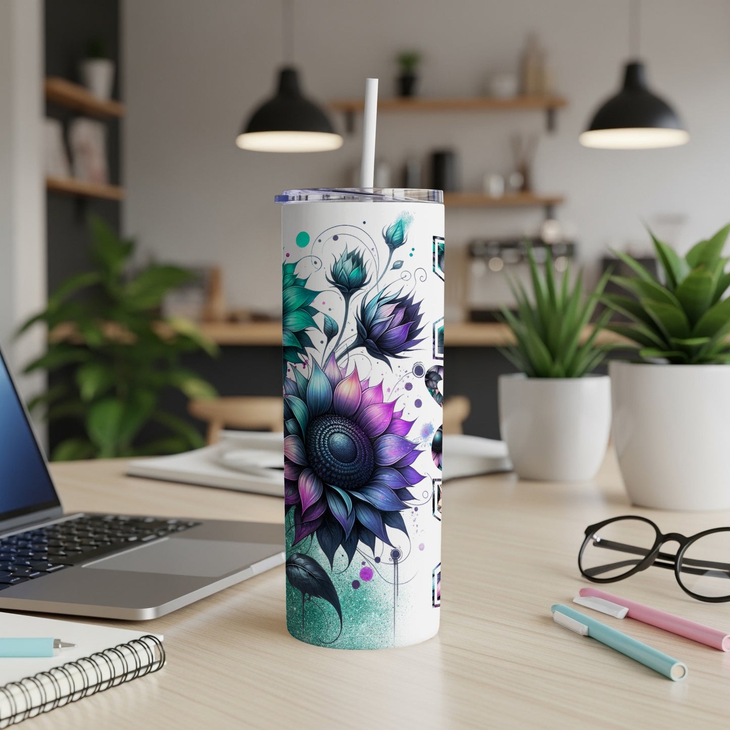 Tumbler with a purple and teal sunflower design and a white straw.