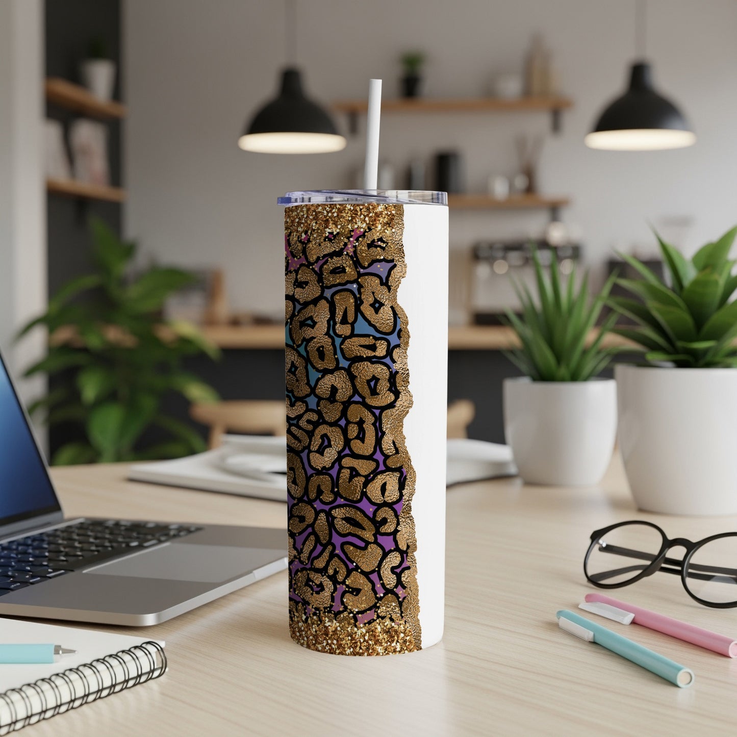 White tumbler with leopard print and gold glitter detail.