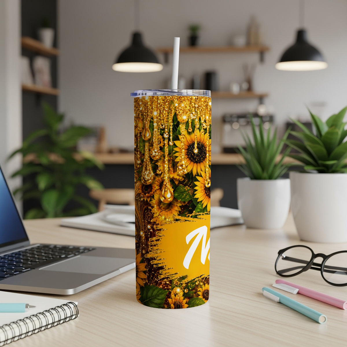 Tumbler with sunflowers, gold glitter drips, and the initial "M".