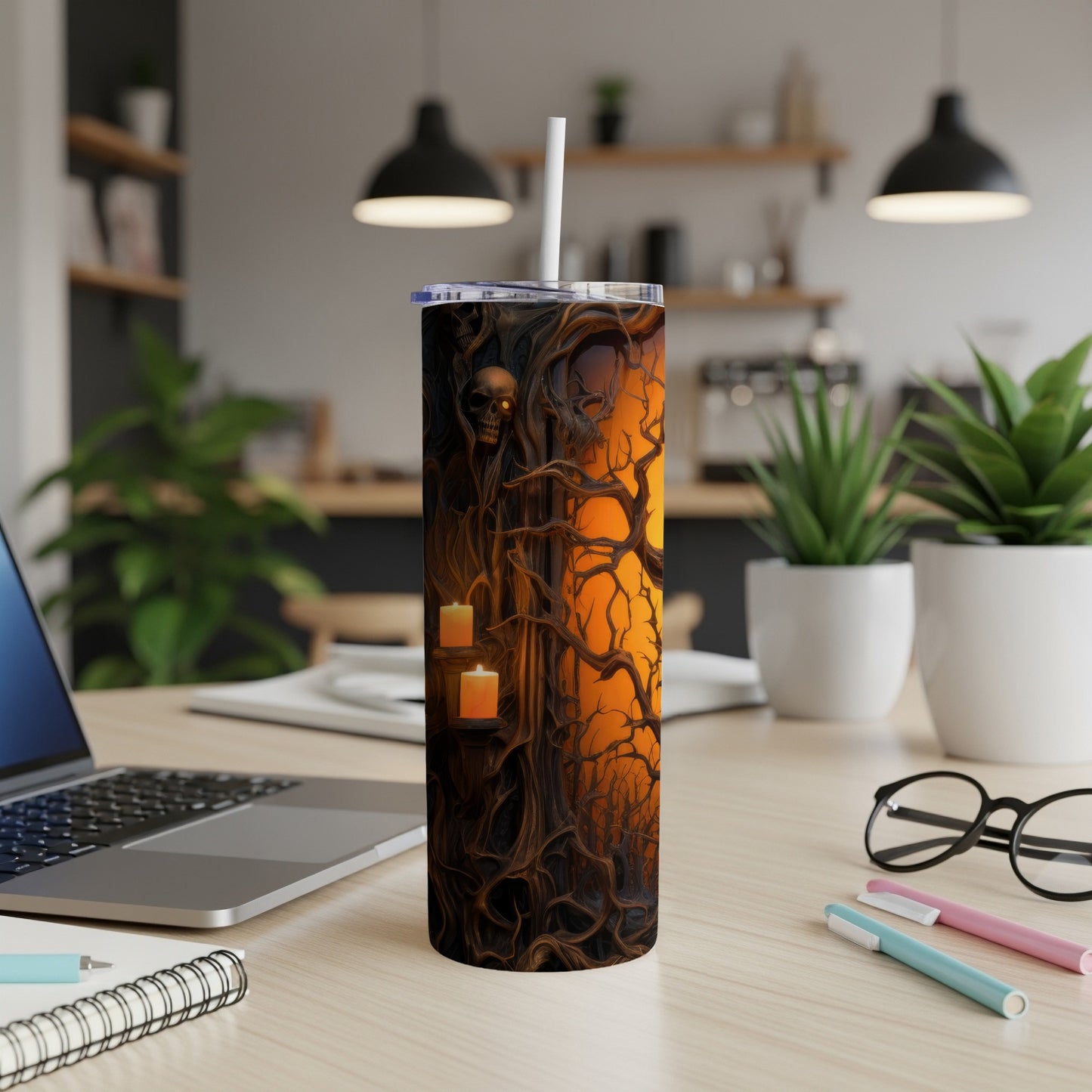 Tumbler with spooky forest scene, skull, and candles.