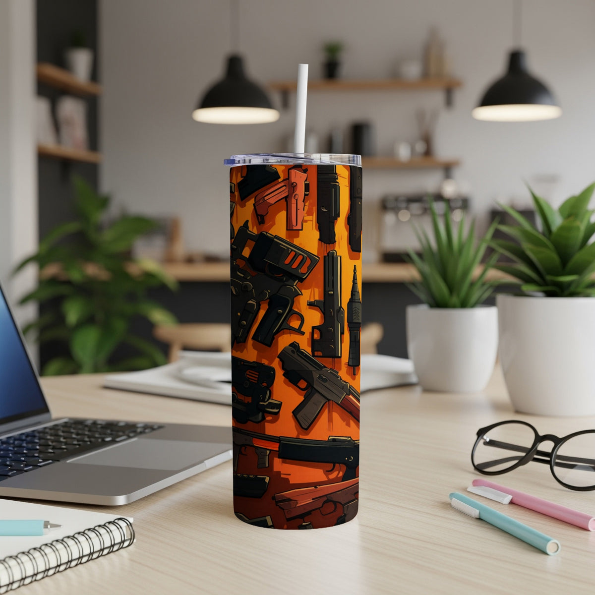 Tumbler with an orange background and a pattern of various firearms.