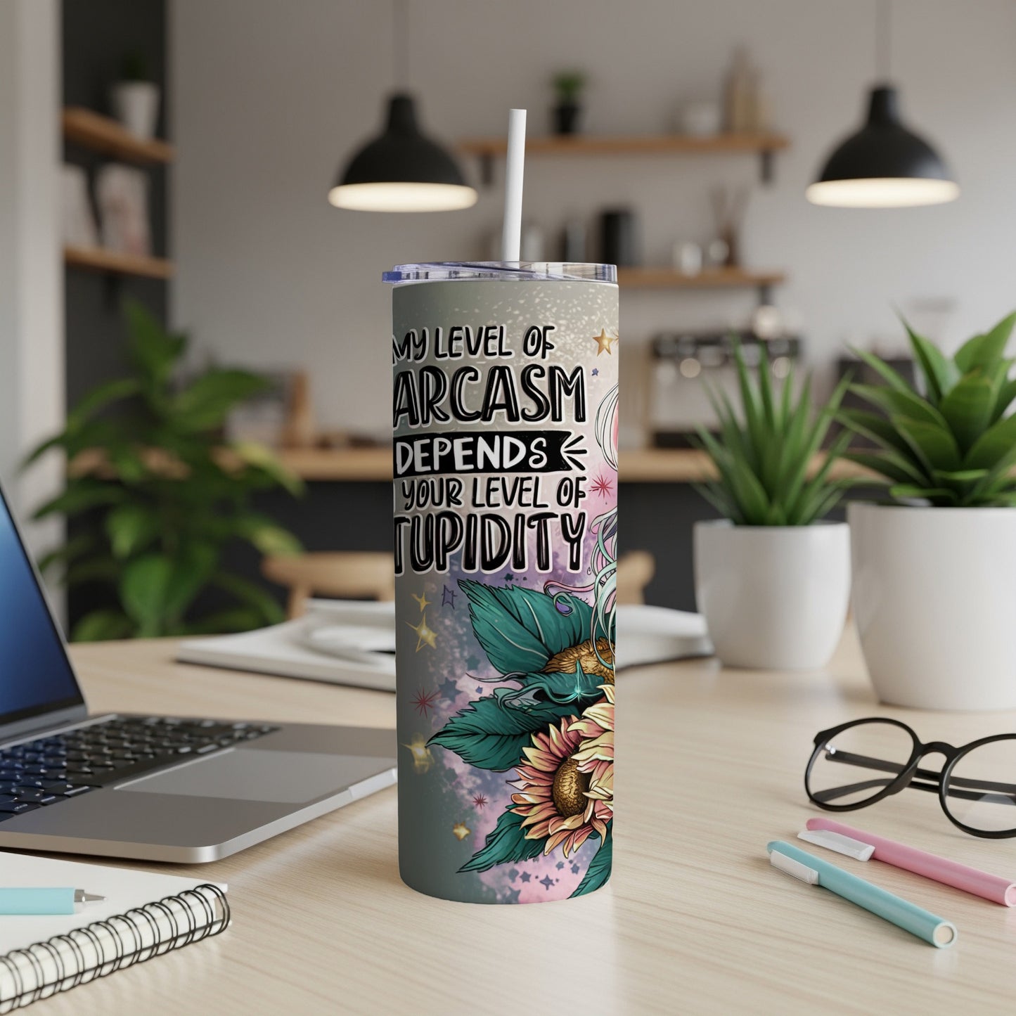 "My level of sarcasm depends your level of stupidity" text on a floral skinny tumbler.