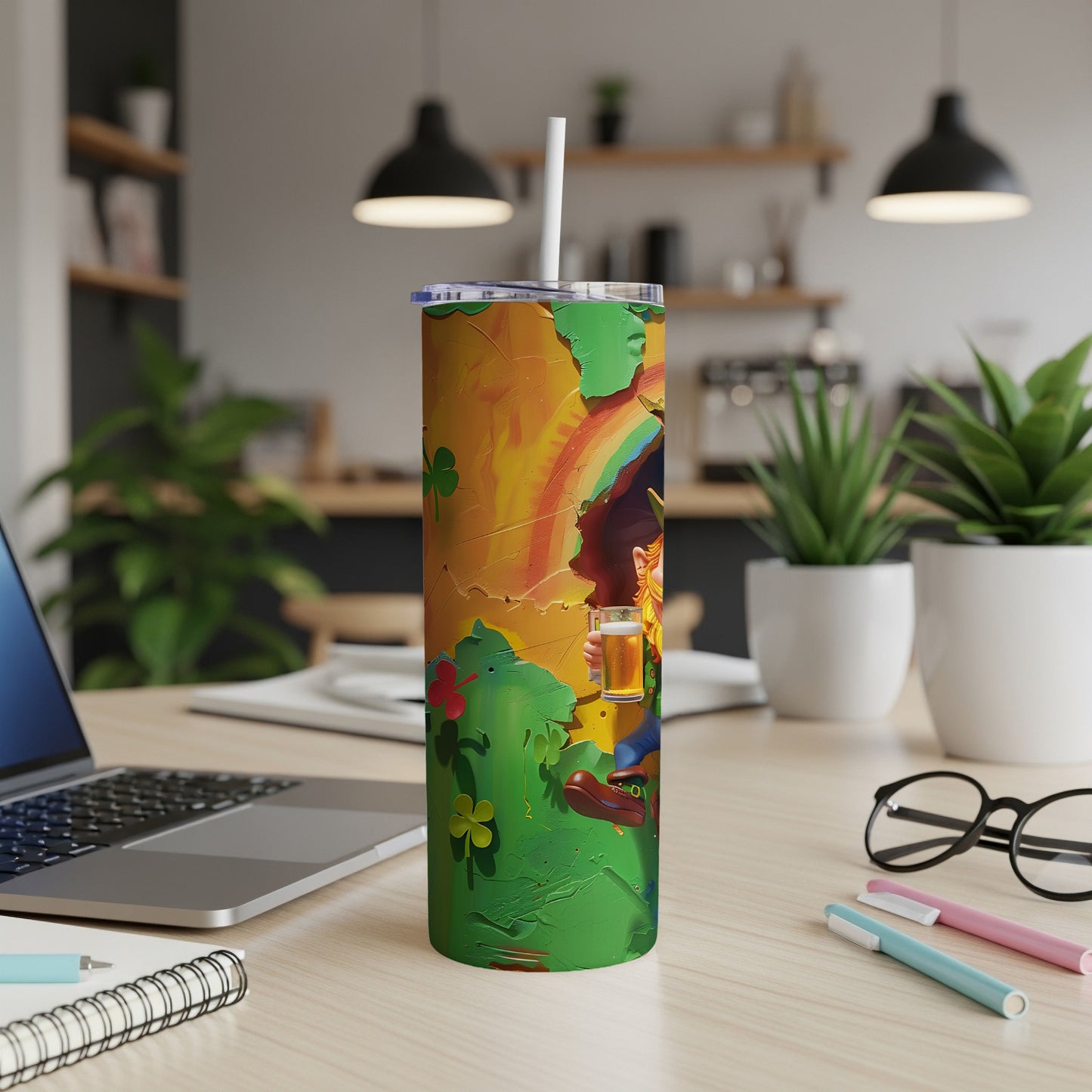 Leprechaun holding a beer mug with a rainbow and shamrocks on a tumbler.