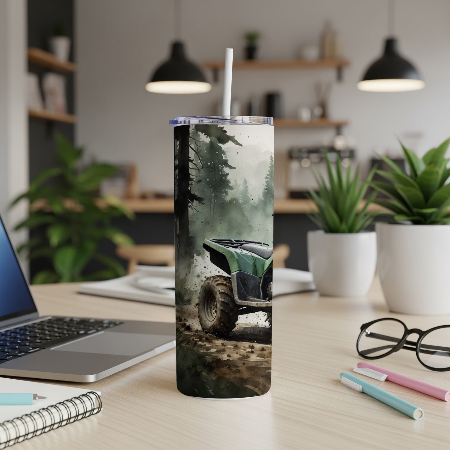 Green ATV on a dirt path in a misty forest, printed on a skinny tumbler.