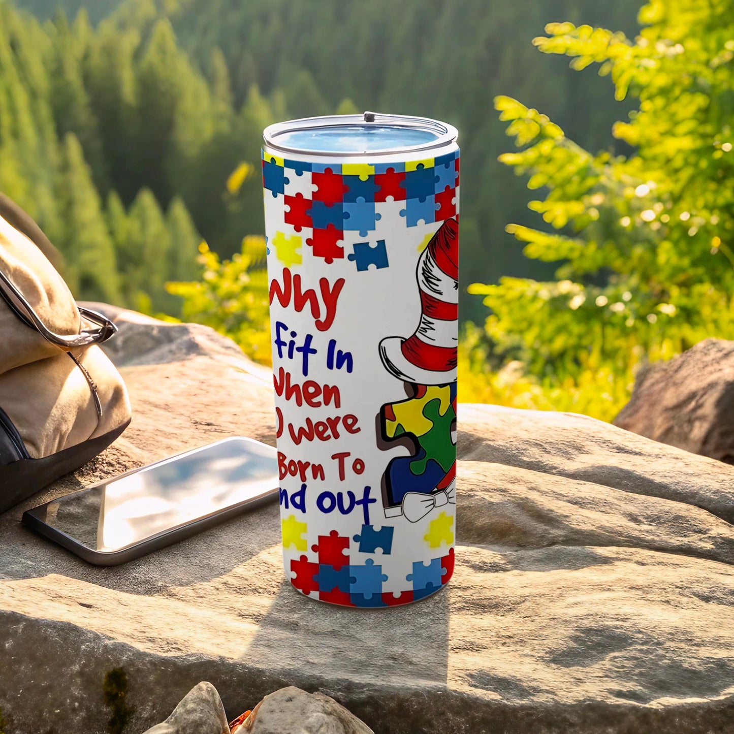 White tumbler with colorful puzzle pieces and text "Why fit in When You Were Born To Stand Out".