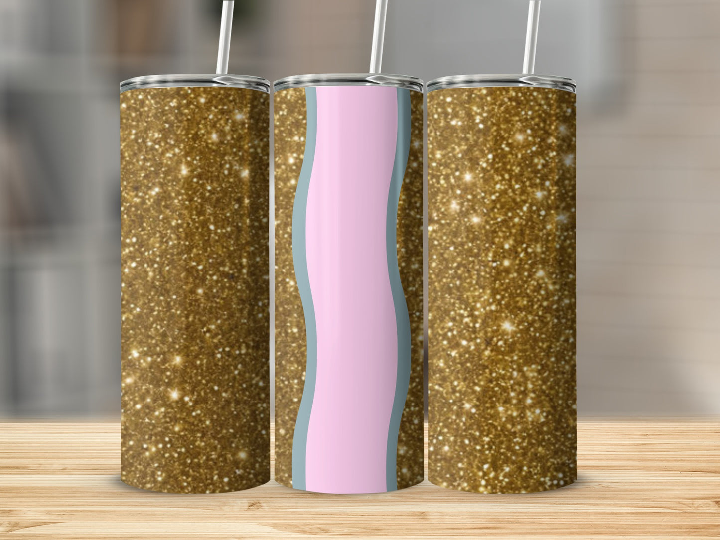 Two gold glitter tumblers flank a pink and blue wavy design tumbler.