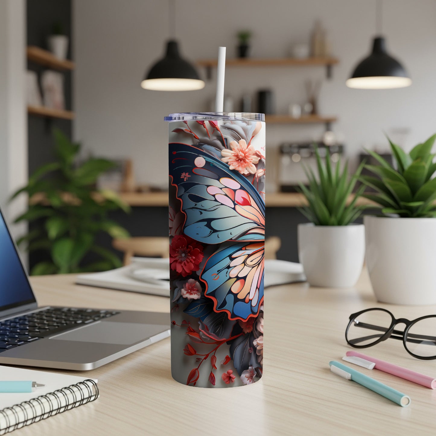 Tumbler with a colorful butterfly and floral design.