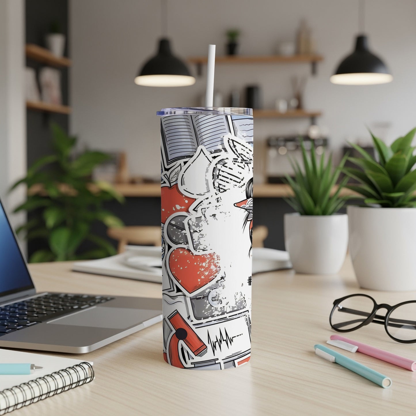 White skinny tumbler with medical and educational graphic designs.