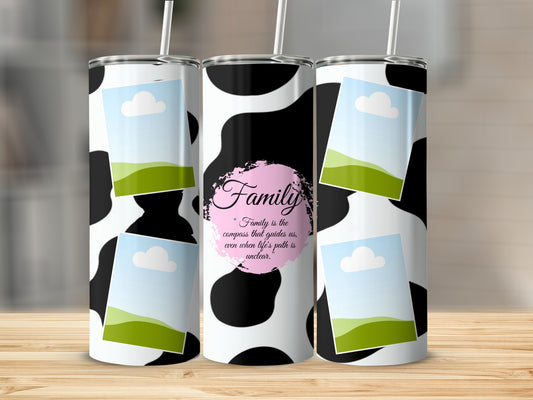 Three tumblers with cow print, framed photos, and "Family is the compass" quote.