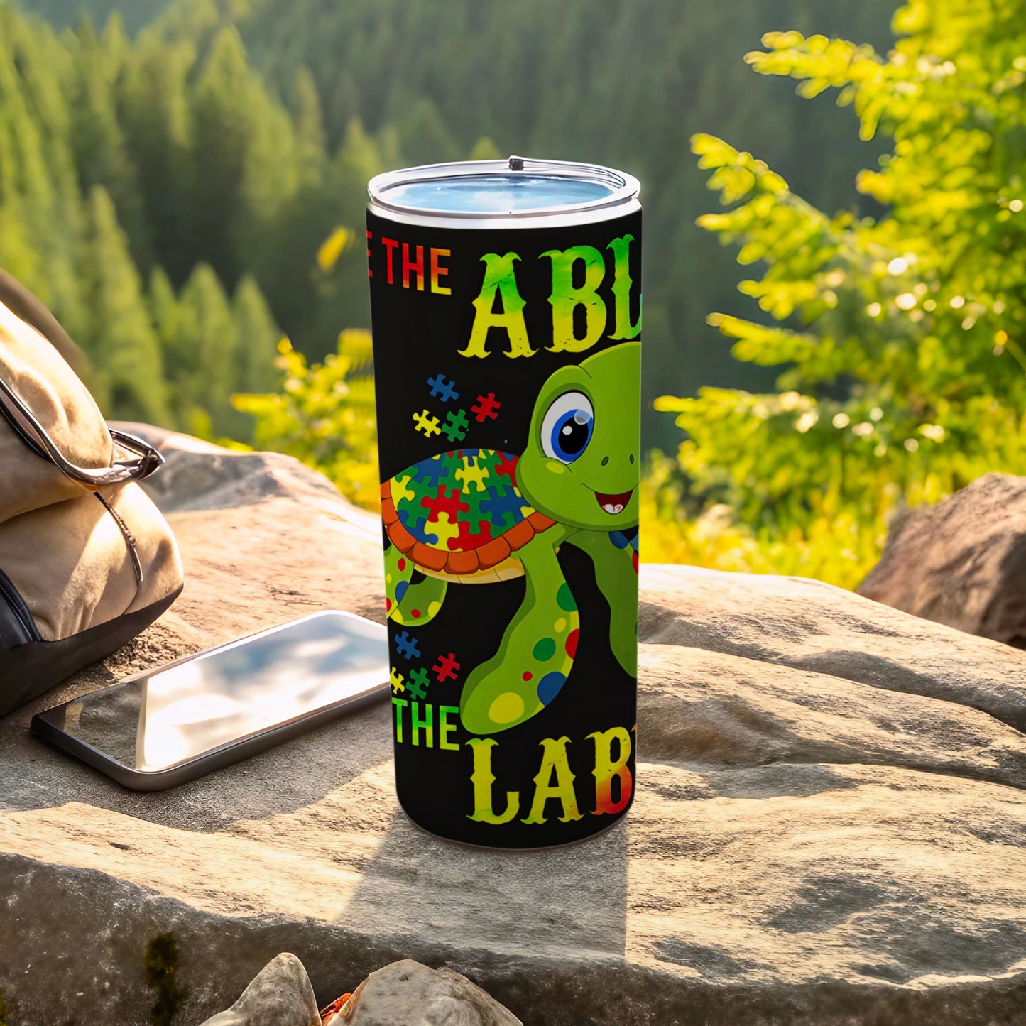 Turtle tumbler with "The Able The Lab" text and autism puzzle pieces.