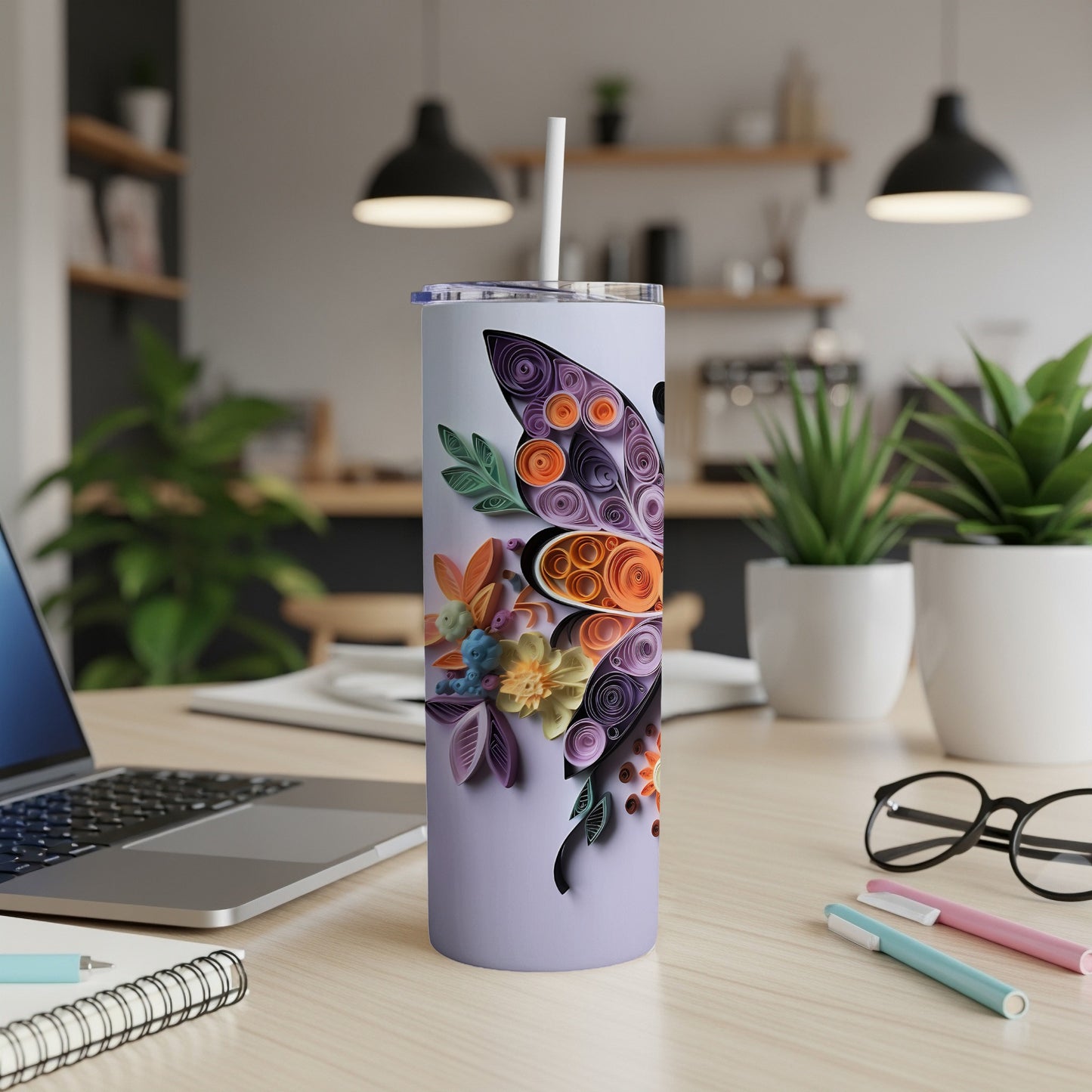 Tumbler with purple and orange butterfly and floral quilled paper design.