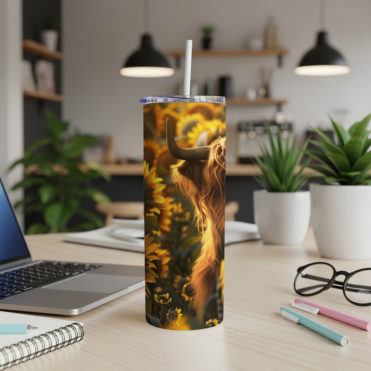Highland cow in sunflowers on a tumbler.