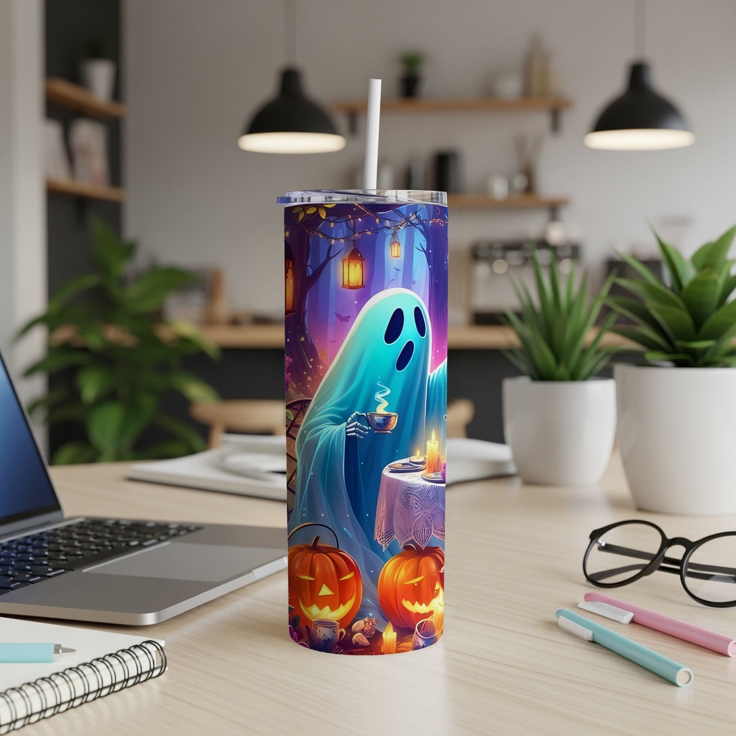 Halloween tumbler with a ghost drinking tea, featuring pumpkins and a forest scene.