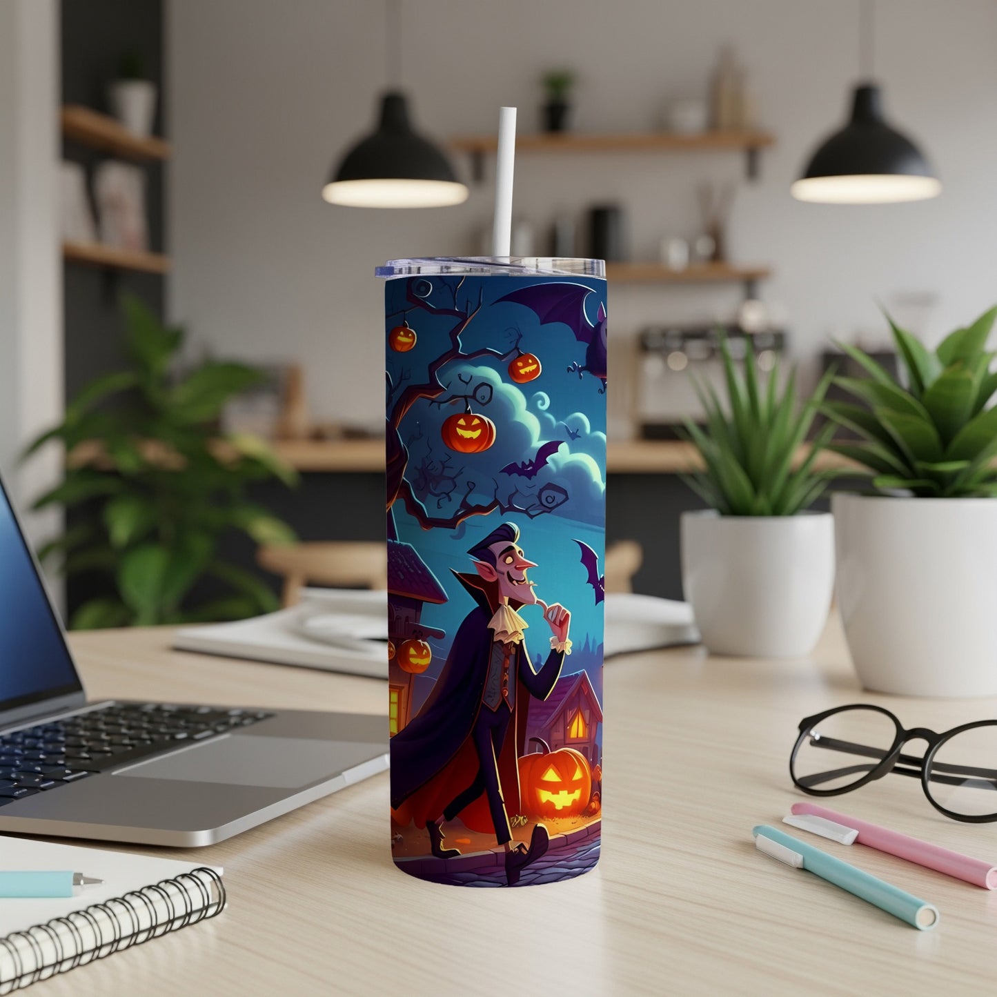 Tumbler with cartoon vampire, pumpkins, and bats on a Halloween night.